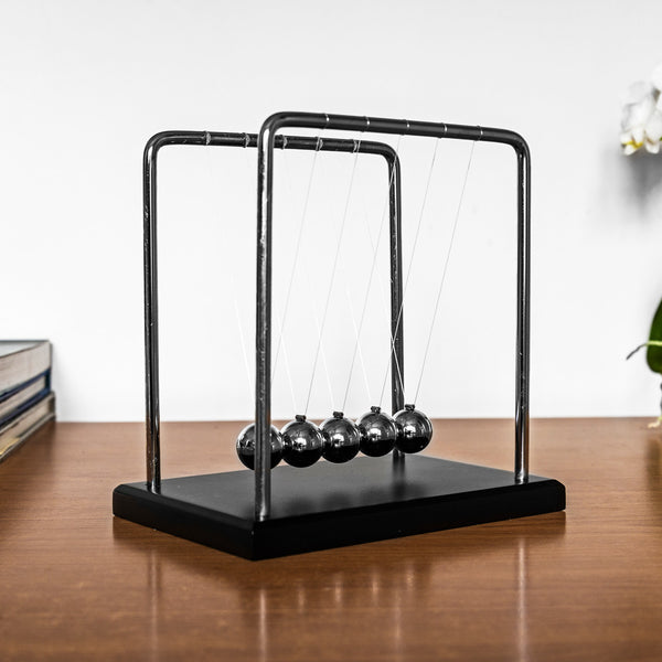 The Source Newton's Cradle